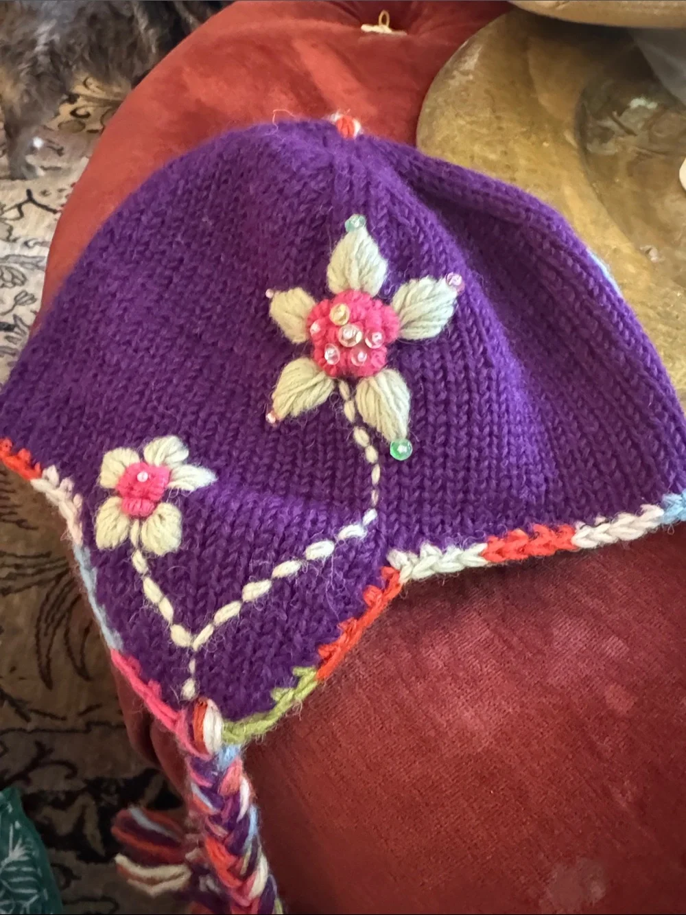 Everest Designs Purple Floral Knit Earflap Hat for Kids with Braided Tassels